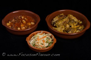 Chicken with garlic and saffron; patatas bravas; cabbage, green pepper and caraway salad