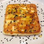 Saganaki with Black Sesame Seeds and Honey